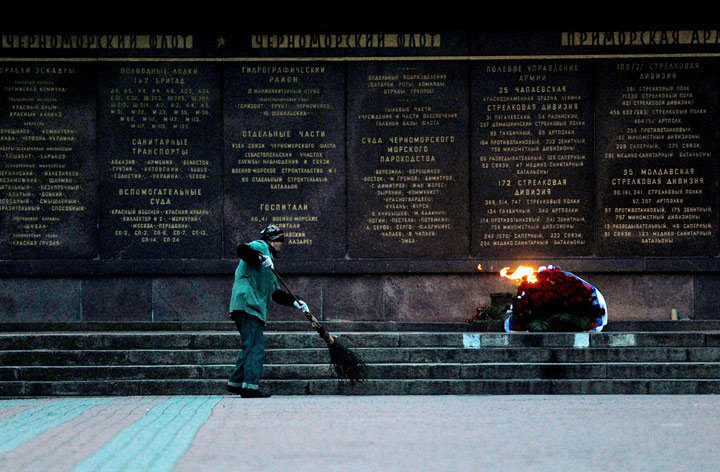 A municipal worker cleans the area at the WW II Memorial to the Heroes of the Defense of Sevastopol 1941-1942 in Sevastopol, on April 2, 2014. 