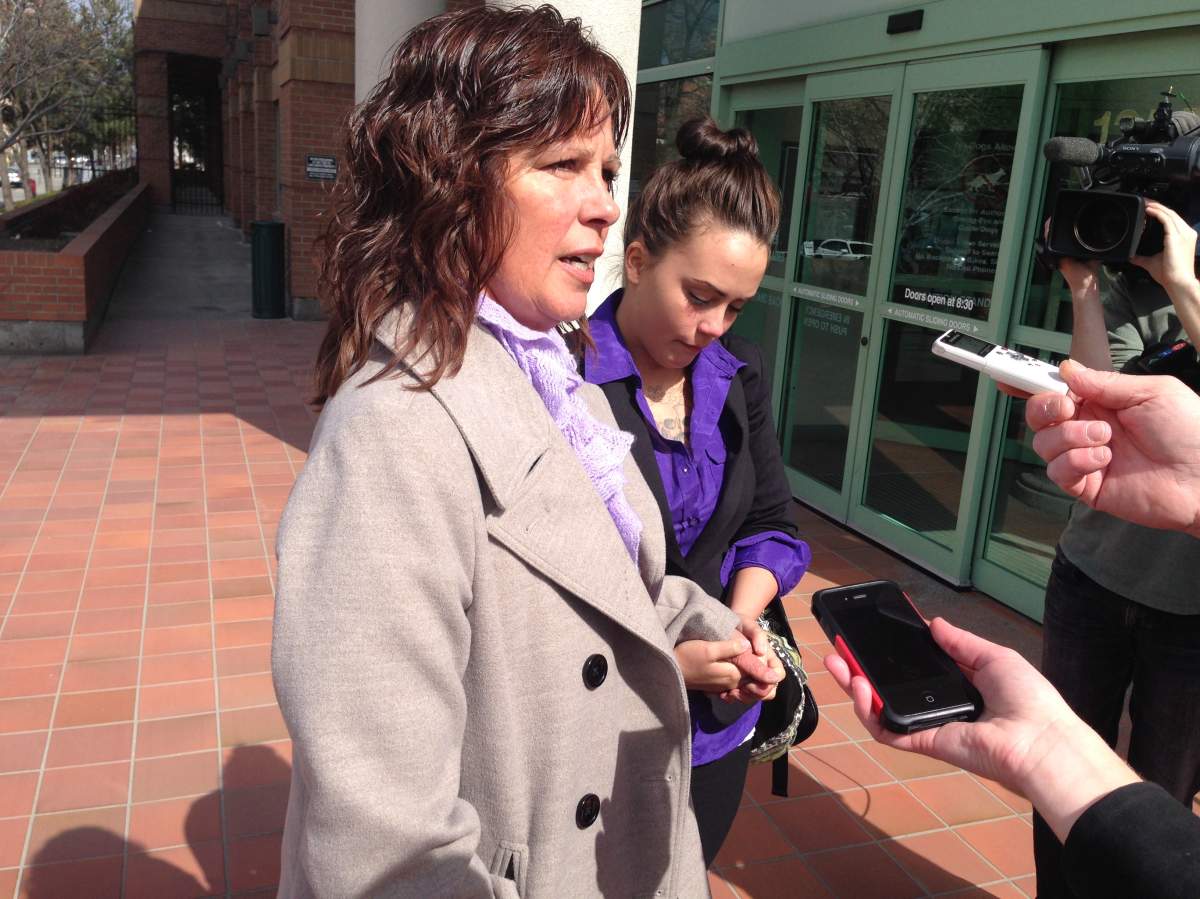Taylor Van Diest's mom and sister hold hands outside the courthouse after a guilty verdict was reached.