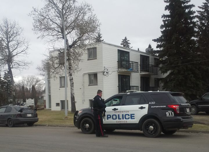 Police investigate after a man's body was found inside an apartment suite in the area of 89 Ave. and 149 St. Saturday, April 26, 2014.