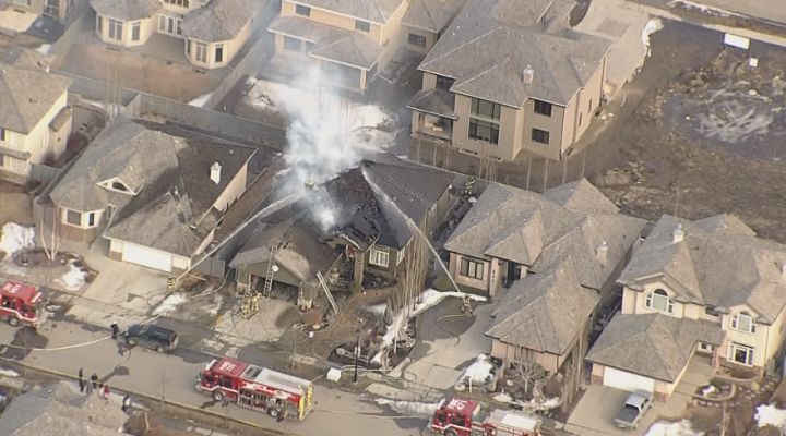 Edmonton fire fighters battle a blaze in west Edmonton, Sunday, April 5, 2014. 