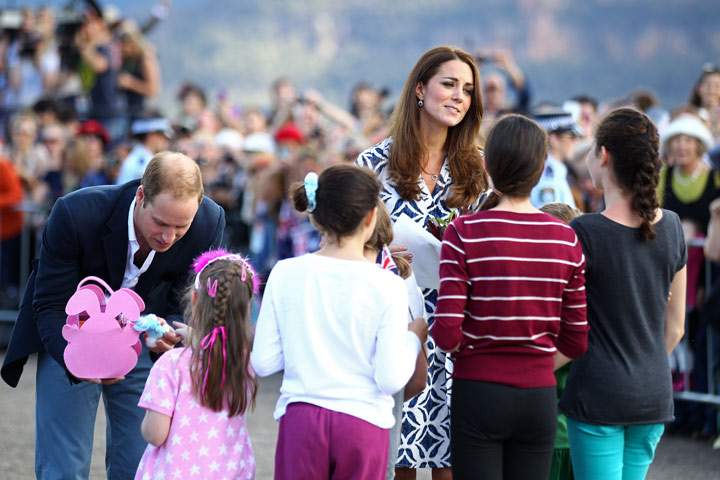 Prince William, Duke of Cambridge and Catherine, Duchess of Cambridge speak with a group of young children during a visit to Echo Point on April 17, 2014 in Katoomba, Australia.