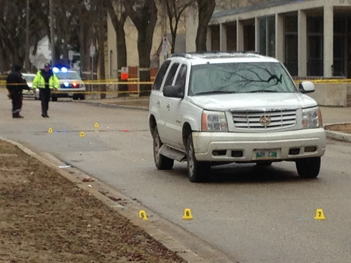 Police investigate after a teenager was hit by an SUV near Grosvenor School in Winnipeg on Monday.