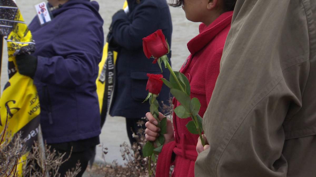 People gather in Fredericton to remember those who have lost their lives while on the job. 