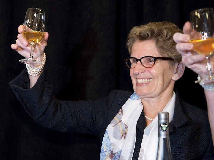 Ontario Premier Kathleen Wynne celebrates the grape harvest by toasting with Ontario Ice Wine at an event in an LCBO in Toronto on Wednesday January 15, 2014. 