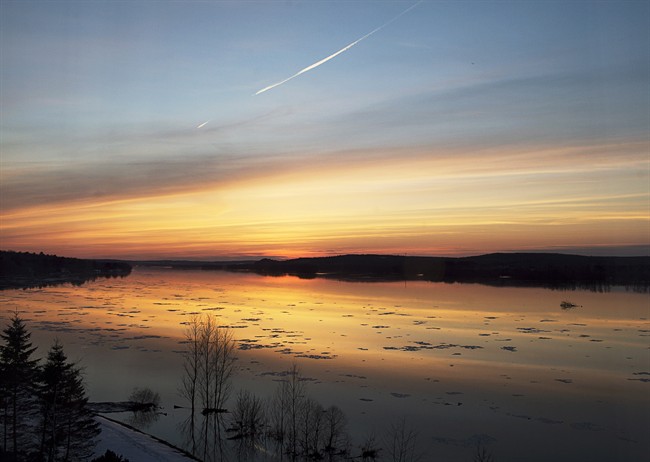 The sun sets on the St. John River in Fredericton on Thursday, April 17, 2014.