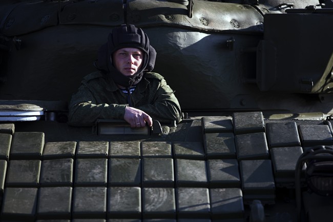Russian solder sits in the tank T-72B at the Ostryakovo railway station not far from Simferopol, Crimea, Monday, March 31, 2014. 
