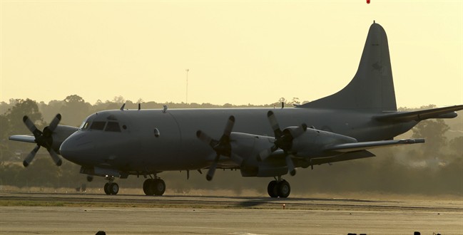 A Royal Australian Air Force P-3 Orion taxies along the tarmac at RAAF Base Pearce as it arrives back from the on-going search operations for missing Malaysia Airlines Flight MH370 in Perth, Australia, Tuesday, April 8, 2014.