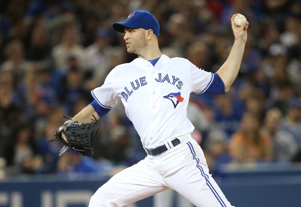  J.A. Happ #48 of the Toronto Blue Jays delivers a pitch in the fifth inning during MLB game action against the Cleveland Indians on May 15, 2014 at Rogers Centre in Toronto, Ontario, Canada. (Photo by Tom Szczerbowski/Getty Images).
