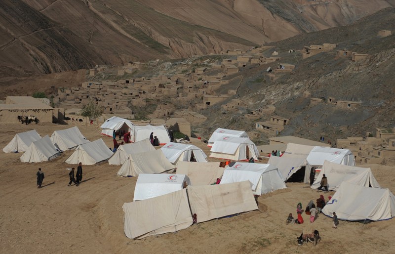 Landslide-affected Afghan villagers are pictured at their relief tents near the scene of the incident in Argo district in Badakhshan on May 4, 2014.  AFP PHOTO/FARSHAD USYAN.