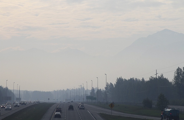 Haze from smoke covers a highway in Anchorage, Alaska, Thursday, May 22, 2014.