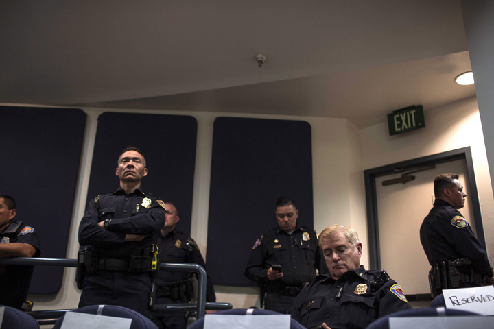 Albuquerque police chief Gorden Eden sits in audience during a city council meeting in Albuquerque, N.M., Thursday, May 8, 2014.