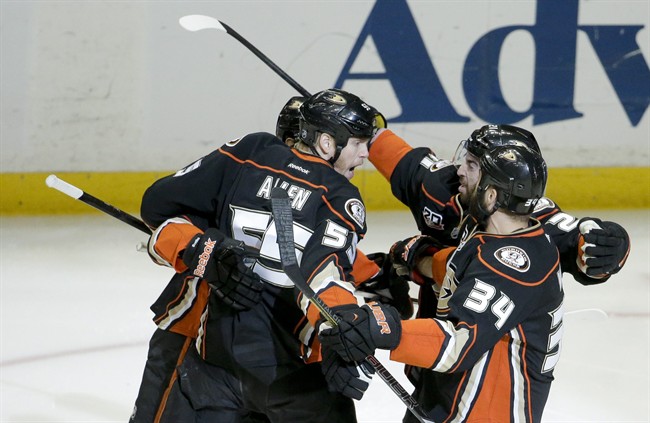 Anaheim Ducks celebrate a goal by Nick Bonino against the Los Angeles Kings during the first period in Game 5 of an NHL hockey second-round Stanley Cup playoff series in Anaheim, Calif., Monday, May 12, 2014. (AP Photo/Chris Carlson).