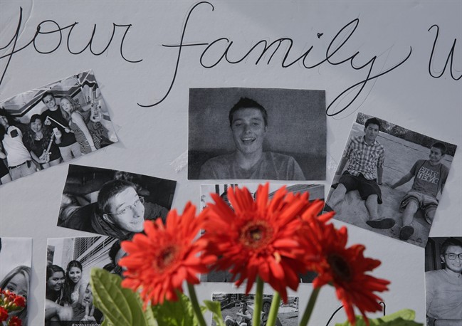 Images of Christopher Martinez are displayed as part of a memorial in front of the IV Deli Mart, where part of Friday night's mass shooting took place, on Sunday, May 25, 2014, in the Isla Vista beach community of Santa Barbara, Calif. 