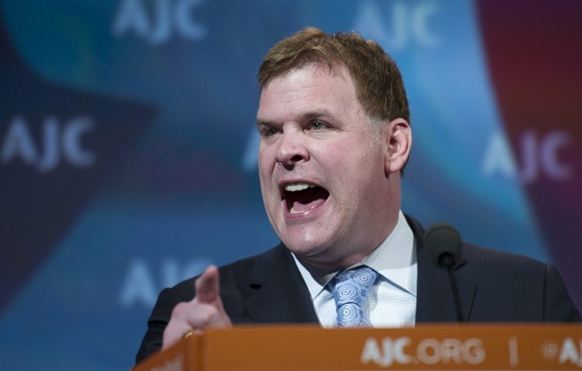 Canadian Foreign Minister John Baird gestures as he addresses the American Jewish Committee (AJC) Global Forum closing plenary in Washington, Wednesday, May 14, 2014.