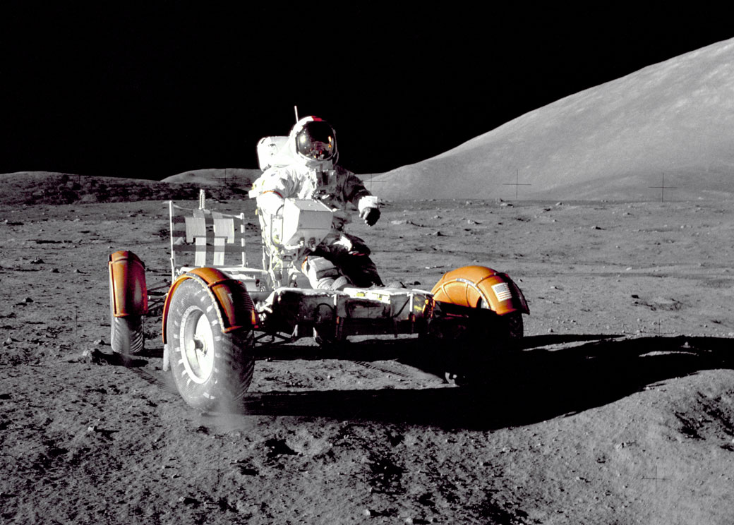 Apollo 17 commander Eugene Cernan test-drives the rover before it is loaded with gear to explore the lunar surface.