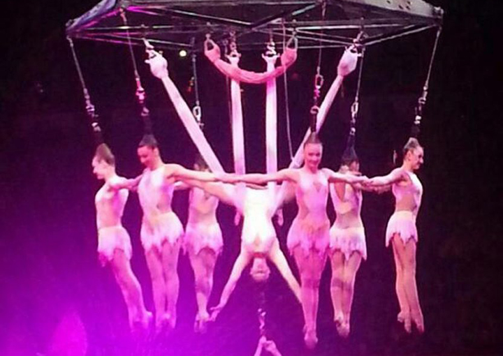 In this photo provided by Frank Caprio, performers hang during an aerial hair-hanging stunt at the Ringling Brothers and Barnum and Bailey Circus, Friday, May 2, 2014, in Providence, R.I. 