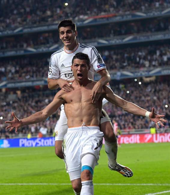 Real's Cristiano Ronaldo, foreground gestures, at the end of the Champions League final soccer match between Atletico Madrid and Real Madrid, at the Luz stadium, in Lisbon, Portugal, Saturday, May 24, 2014. (AP Photo/Manu Fernandez).