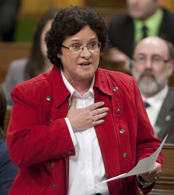 Francoise Boivin, NDP MP for Gatineau, rises during question period in the House of Commons on Parliament Hill in Ottawa on February 2, 2012. The federal Justice Department has chopped $1.2 million from its research budget, and is tightening control to ensure future legal research is better aligned with the government's law-and-order agenda.
