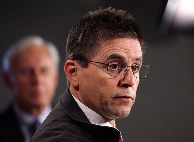 Hassan Diab, the Ottawa professor who has been ordered extradited to France by the Canadian government, speaks at a press conference while his lawyer, Donald Bayne, listens on Parliament Hill in Ottawa on Friday, April 13, 2012.