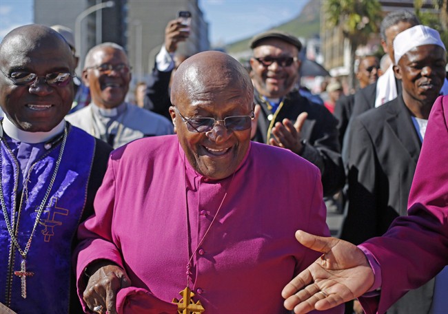 South African Archbishop Desmond Tutu, marches during a rally in Cape Town, South Africa, April 19, 2014. Desmond Tutu is scheduled to appear at a conference in Fort McMurray to discuss aboriginal treaties and the oilsands.
