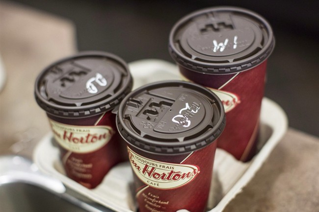 Coffee cups sit at a Tim Hortons in Oakville, Ont.
