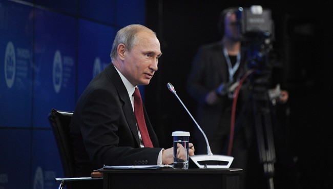 Russian President Vladimir Putin speaks of the St. Petersburg Friday, May 23, 2014. THE CANADIAN PRESS/AP, Mikhail Klimentyev, Presidential Press Service.