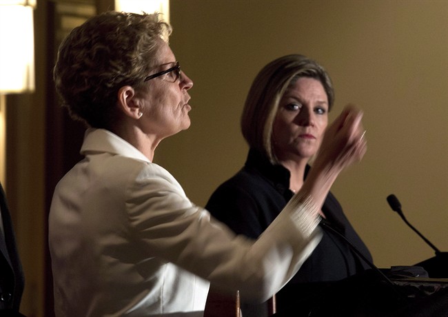 Ontario Liberal Leader Kathleen Wynne, left, and Ontario NDP Leader Andrea Horwath participate in the Northern Leader's Debate in Thunder Bay, on Monday, May 26, 2014. THE CANADIAN PRESS/Frank Gunn.