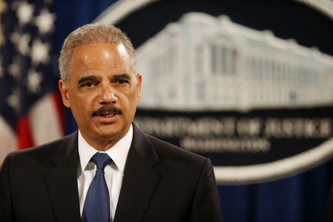 Attorney General Eric Holder speaks at a news conference at the Justice Department in Washington.