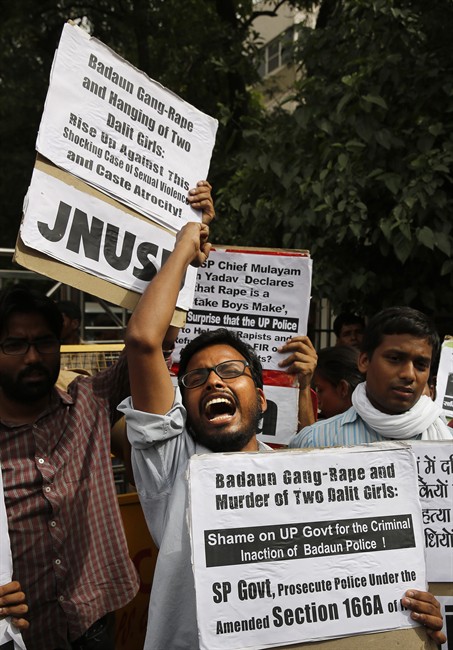 Members of Jawaharlal Nehru University Students Union shout slogans during a protest against a gang rape of two teenage girls in Katra village, outside the Uttar Pradesh state house, in New Delhi, India, Friday, May 30, 2014. 