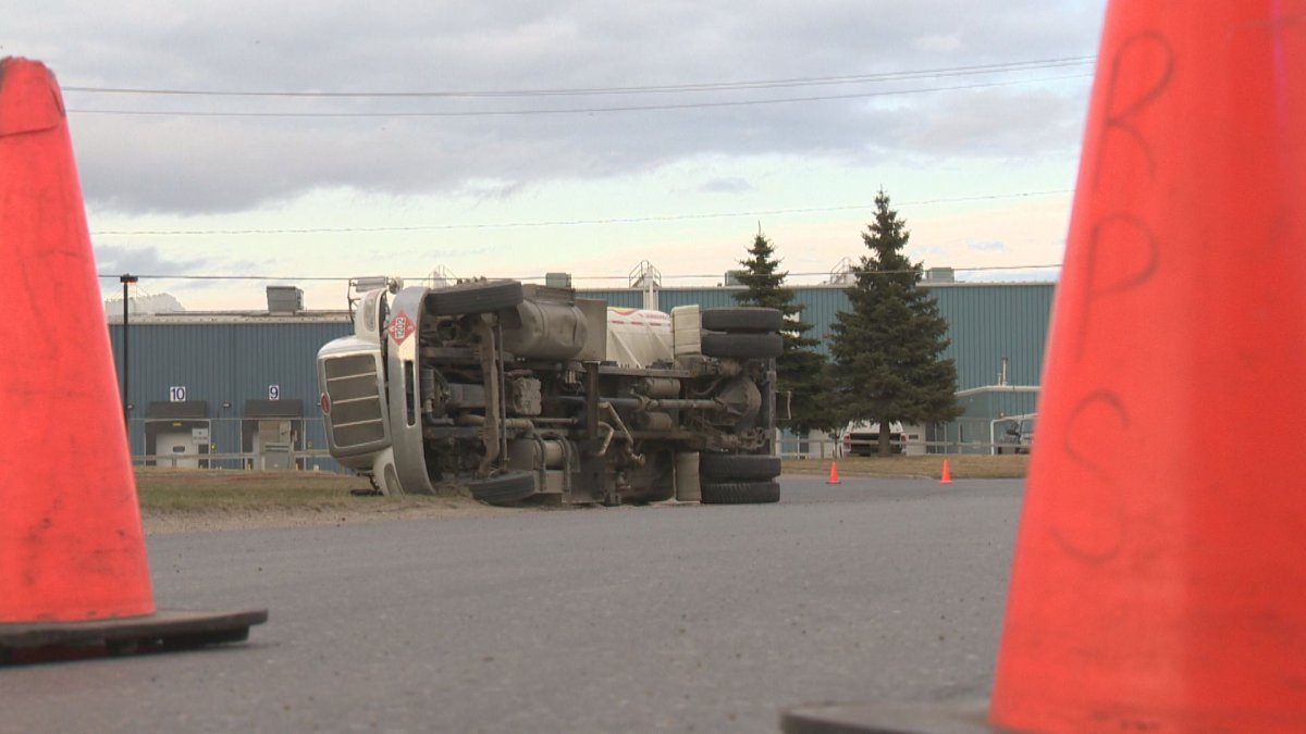 A tanker truck carrying diesel crashes very close to a city sewer grate.