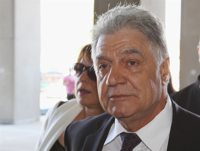 London Mayor Joe Fontana walks to the London, Ont., courthouse on the first day of his fraud trial Monday, May 26, 2014. THE CANADIAN PRESS/Dave Chidley.
