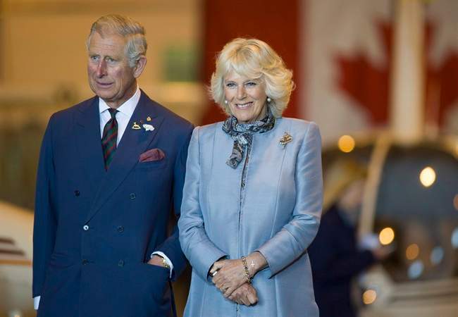 Prince Charles and wife Camilla look on in Winnipeg on Wednesday, May 21, 2014. The royal pair will be returning to Canada this summer.