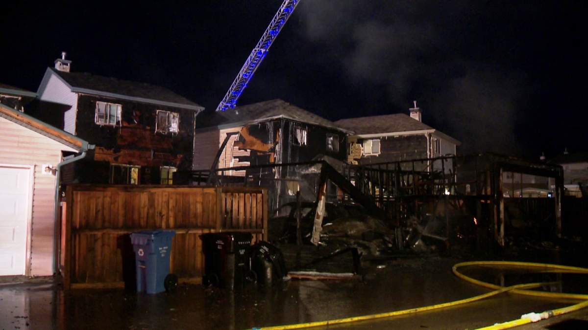 The Calgary Fire Department rushes to an early morning blaze along Covepark Way N.E. on Tuesday, May 13th, 2014.