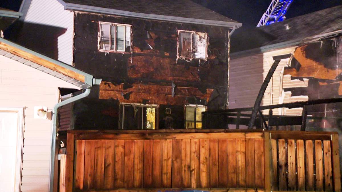 The Calgary Fire Department rushes to an early morning blaze along Covepark Way N.E. on Tuesday, May 13th, 2014.