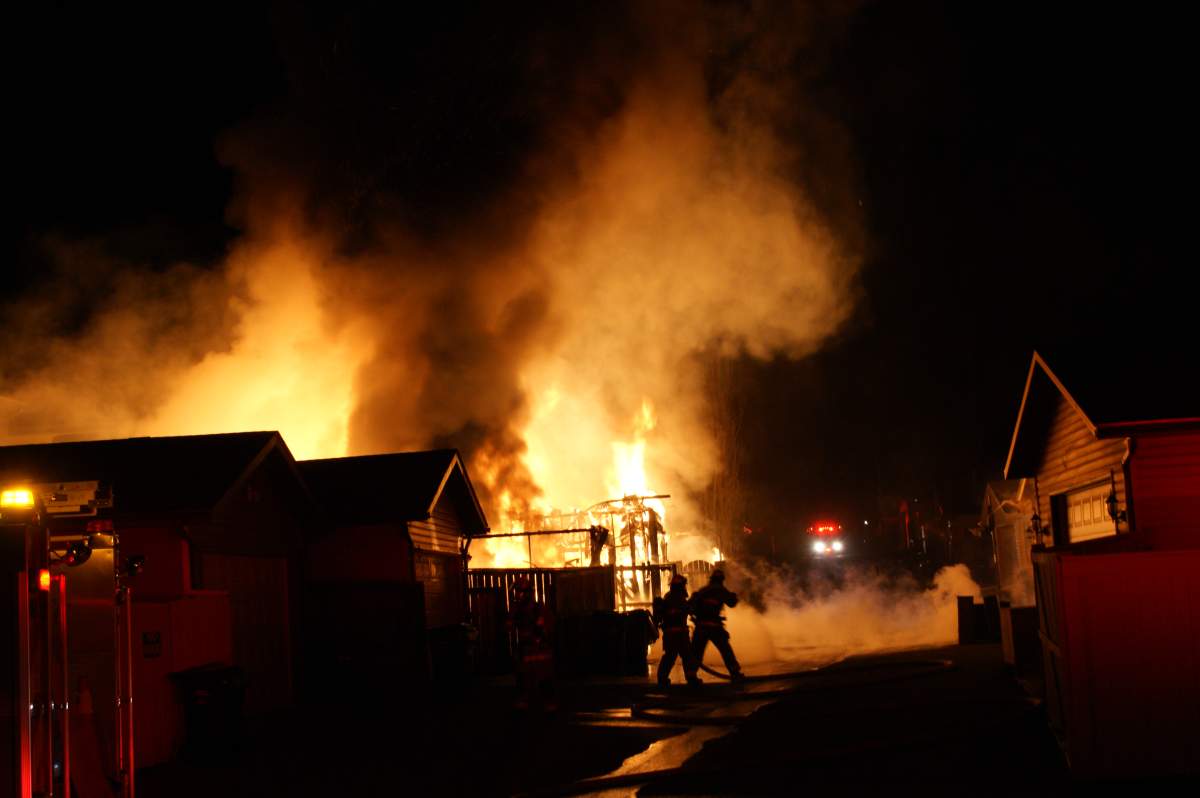 The Calgary Fire Department rushes to an early morning blaze along Covepark Way N.E. on Tuesday, May 13th, 2014.