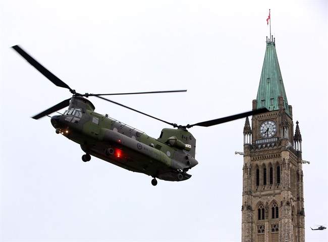 A Canadian Forces CH-147 Chinook helicopter prepares to land on Parliament Hill in preparation for Canada's National Day of Honour.