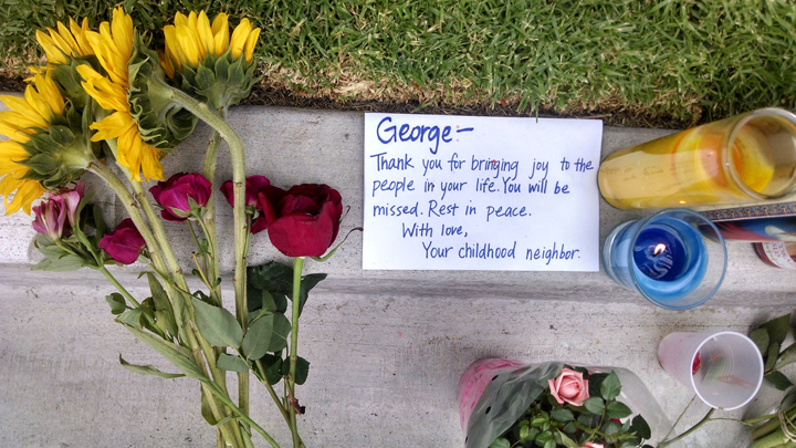 A note addressed to George Chen, 20, of San Jose, Calif., one of three men found stabbed to death in the apartment of Elliott Rodger, is seen outside the apartment where he lived in the Isla Vista neighborhood of Goleta, Calif., Monday, May 26, 2014.