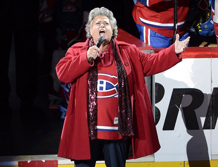 Ginette Reno belts out the national anthem before the Montreal Canadiens and Tampa Bay Lightning National Hockey League first round Stanley Cup playoff game on Tuesday, April 22, 2014 in Montreal.