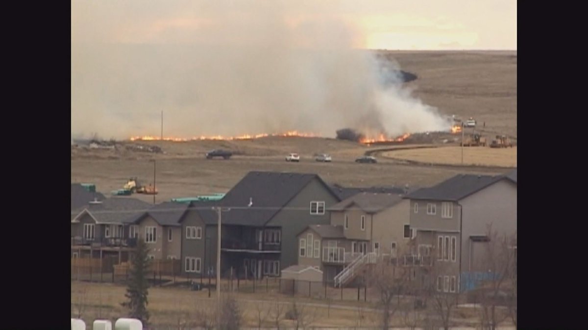A grass fire burns out of control, threatening homes, and a brand new high school. 