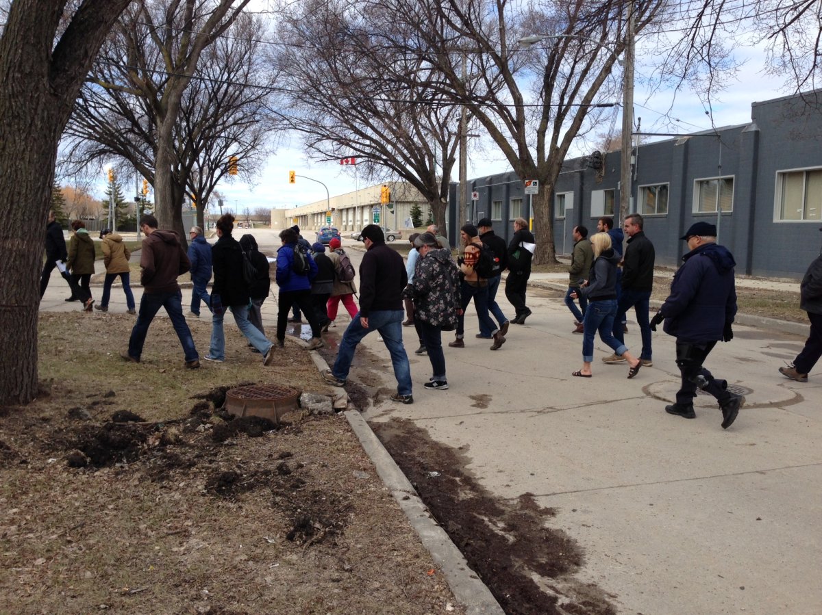Dozens of people enjoy one of the 24 walking tours taking place around Winnipeg this weekend  .