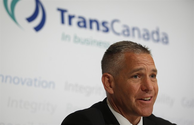 TransCanada CEO Russ Girling speaks to reporters following the company's annual meeting in Calgary, Friday, May 2, 2014.
