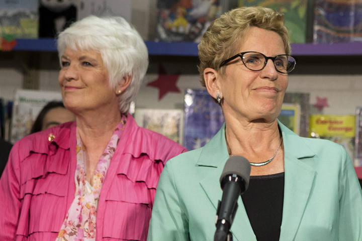 Tim Hudak's "dangerous ideas" to slash 100,000 public sector jobs will drive Ontario back into recession, Premier Kathleen Wynne warned Wednesday