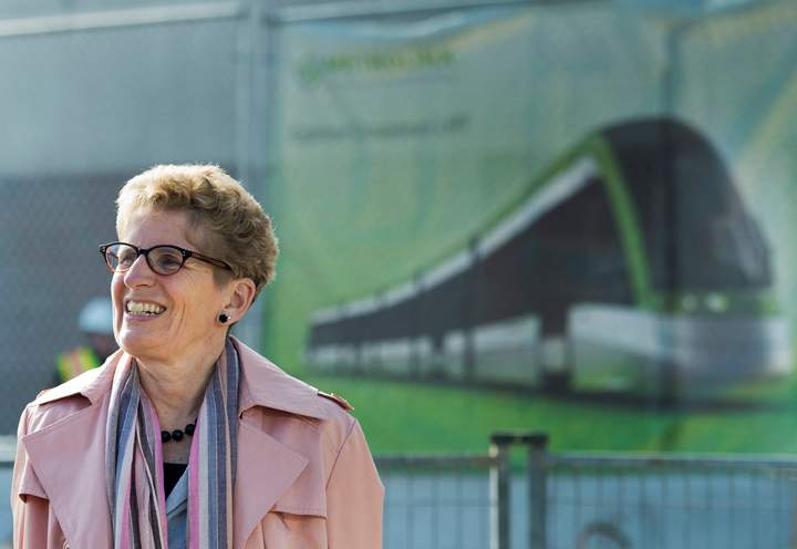 Liberal Leader Kathleen Wynne speaks to the media during a campaign stop at the construction site of the Eglinton LRT on Eglinton Ave. West in Toronto on Tuesday, May 6, 2014.