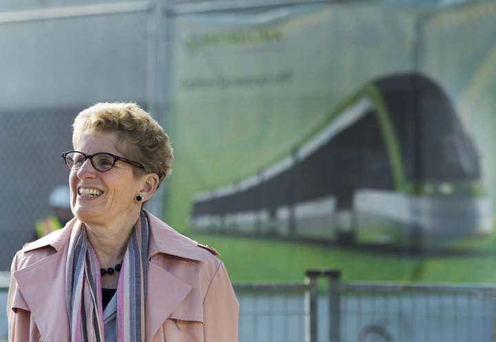 Liberal Leader Kathleen Wynne speaks to the media during a campaign stop at the construction site of the Eglinton LRT on Eglinton Ave. West in Toronto on Tuesday, May 6, 2014.
