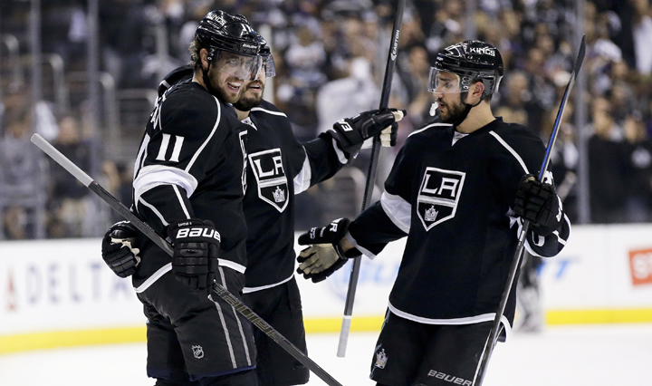 Los Angeles Kings defenseman Drew Doughty, middle, celebrates his goal against the Chicago Blackhawks with center Anze Kopitar, left, and defenseman Alec Martinez during the second period of Game 4 of the Western Conference finals of the NHL hockey Stanley Cup playoffs in Los Angeles, Monday, May 26, 2014. 
