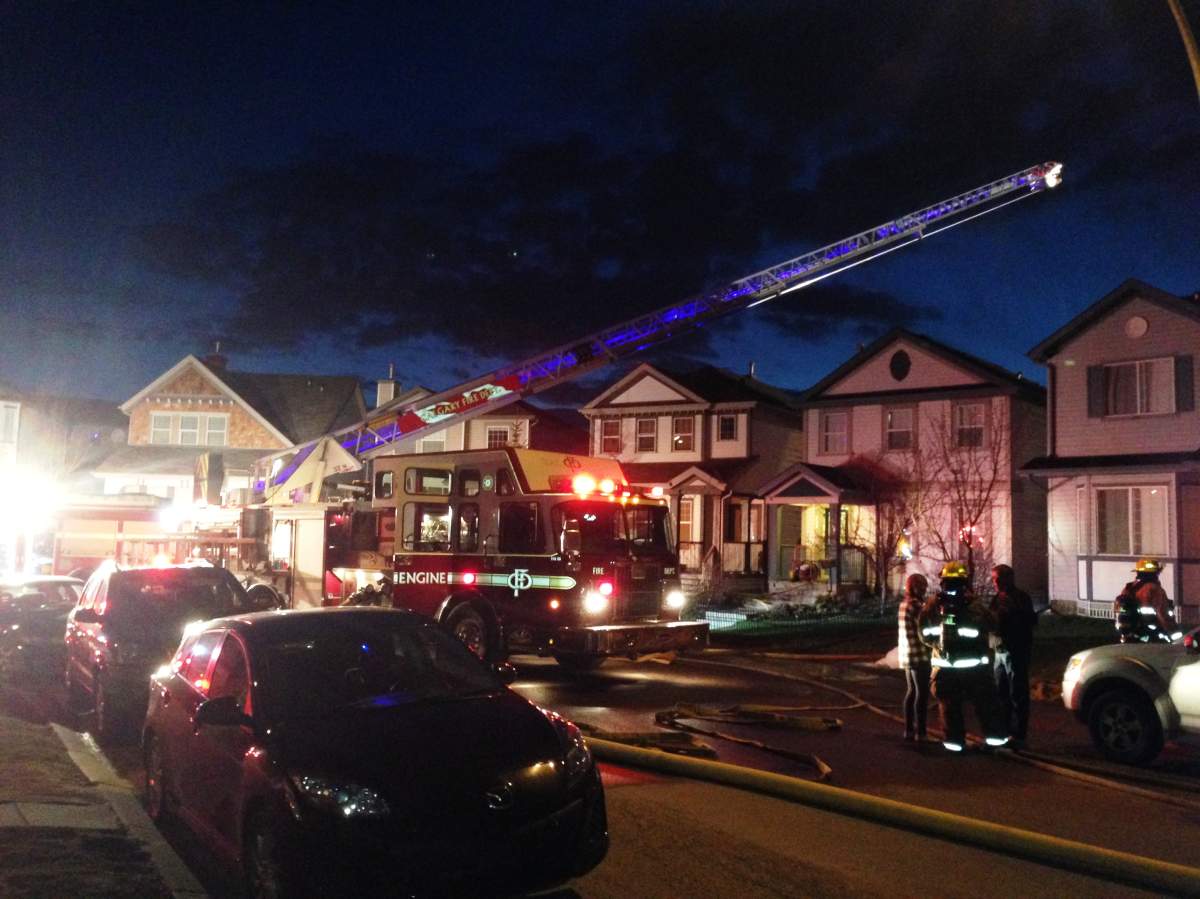 The Calgary Fire Department rushes to an early morning blaze along Covepark Way N.E. on Tuesday, May 13th, 2014.
