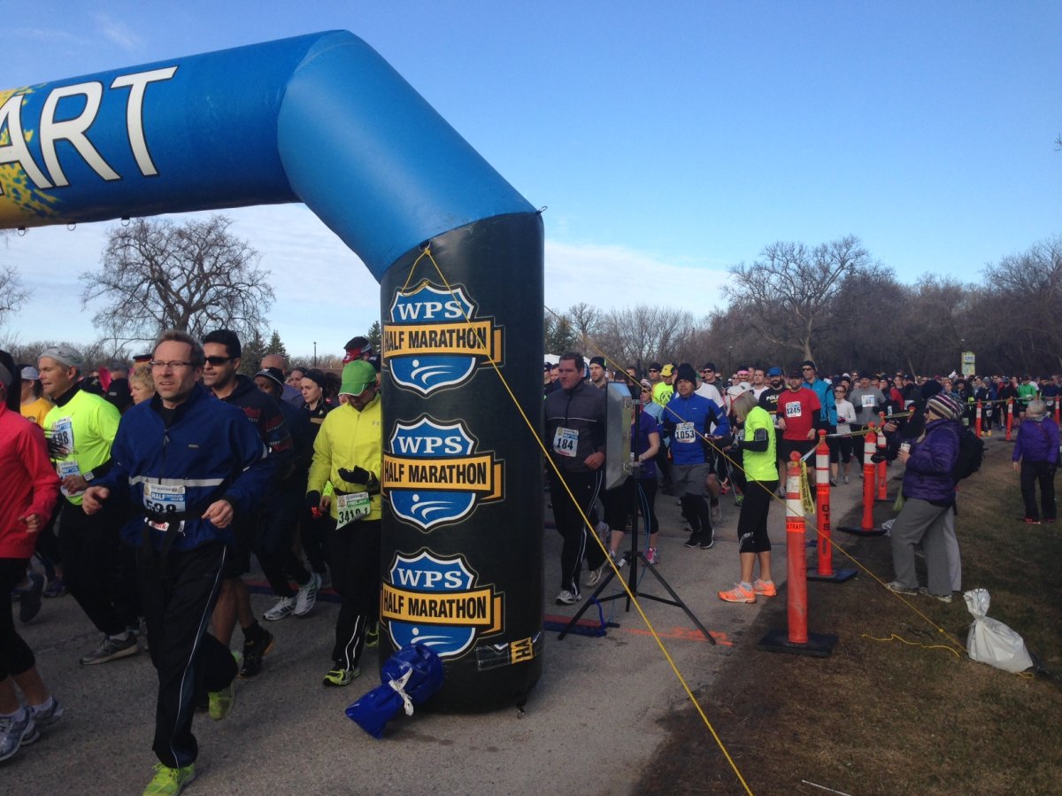 Thousands of Winnipeg Police Service Half Marathon runners take off at the start line .