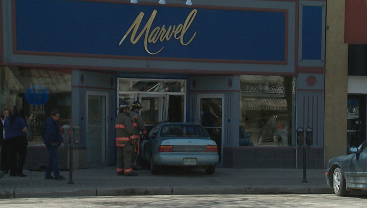 A woman taken to hospital after first striking a vehicle then driving into Marvel Beauty School in downtown Saskatoon on Tuesday morning.