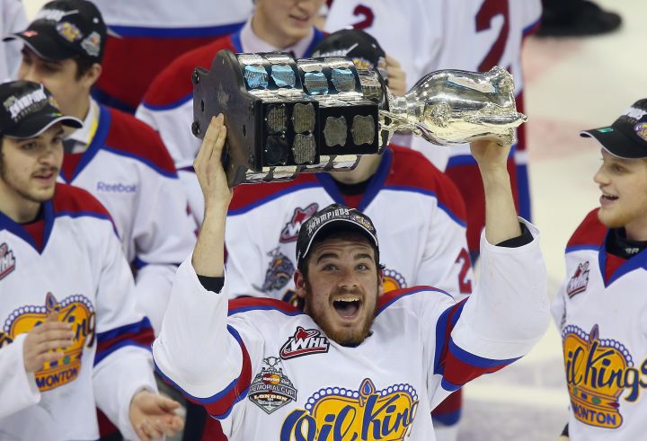 Brandon Baddock #13 of the Edmonton Oil Kings skates with the Memorial Cup trophy following a 6-3 victory over the Guelph Storm in the 2014 Memorial Cup championship game at Budweiser Gardens on May 25, 2014 in London, Ontario, Canada.