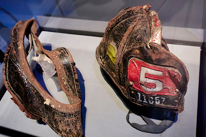 A helmet worn by New York City Fire Department Firefighter Christian Waugh on September 11, 2001 is displayed during a press preview of the National September 11 Memorial Museum at ground zero May 15, 2014 in New York City.
